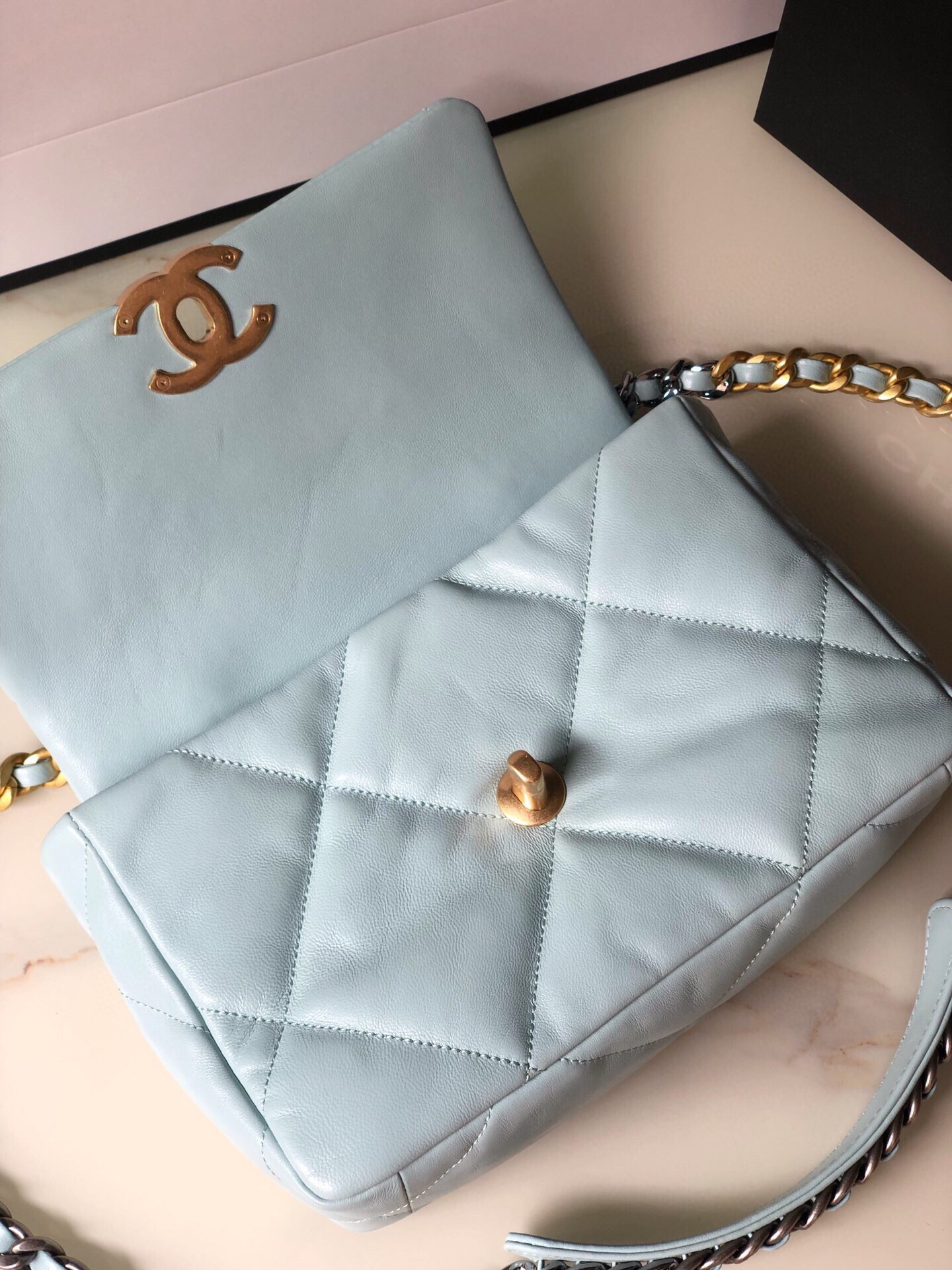 Ch*el 19 handbag shiny leather, gold-tone, silver-tone & ruthenium-finish metal light blue 6.2 × 10.1 × 3.5 in