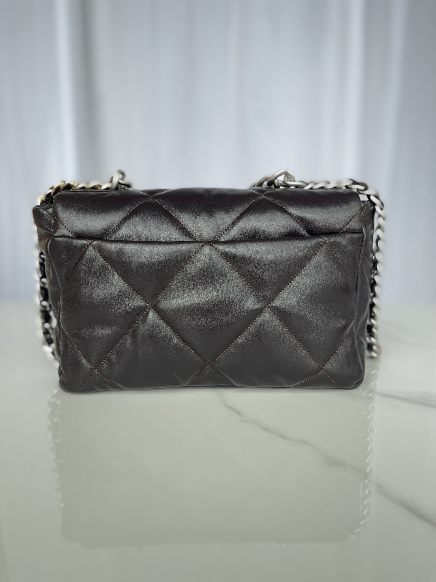 Ch*el 19 large handbag shiny leather black, gold-tone, silver-tone & ruthenium-finish metal 7.8 × 11.7 × 3.9 in