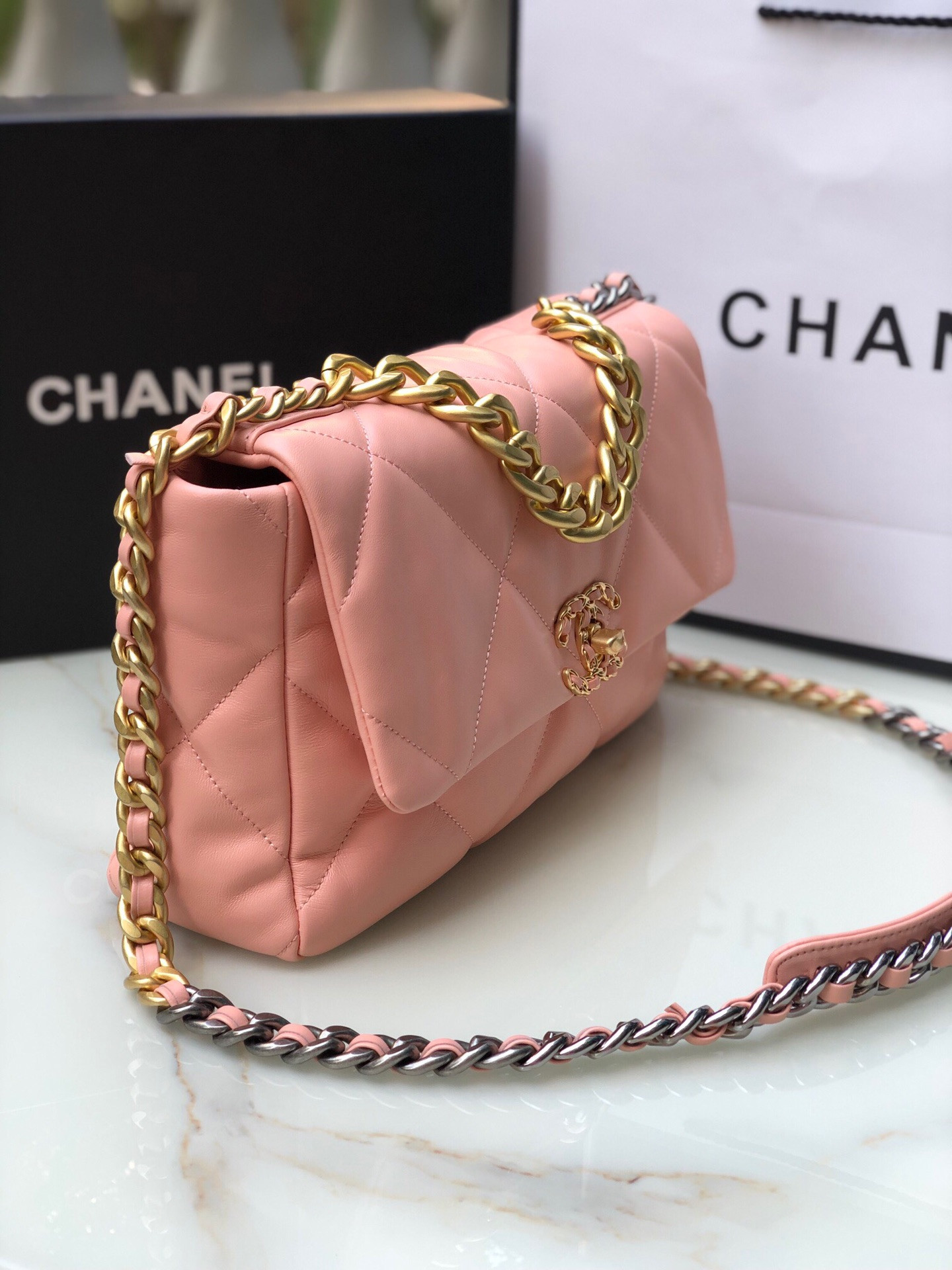Ch*el 19 large handbag shiny leather, gold-tone, silver-tone & ruthenium-finish metal light pink 7.8 × 11.7 × 3.9 in