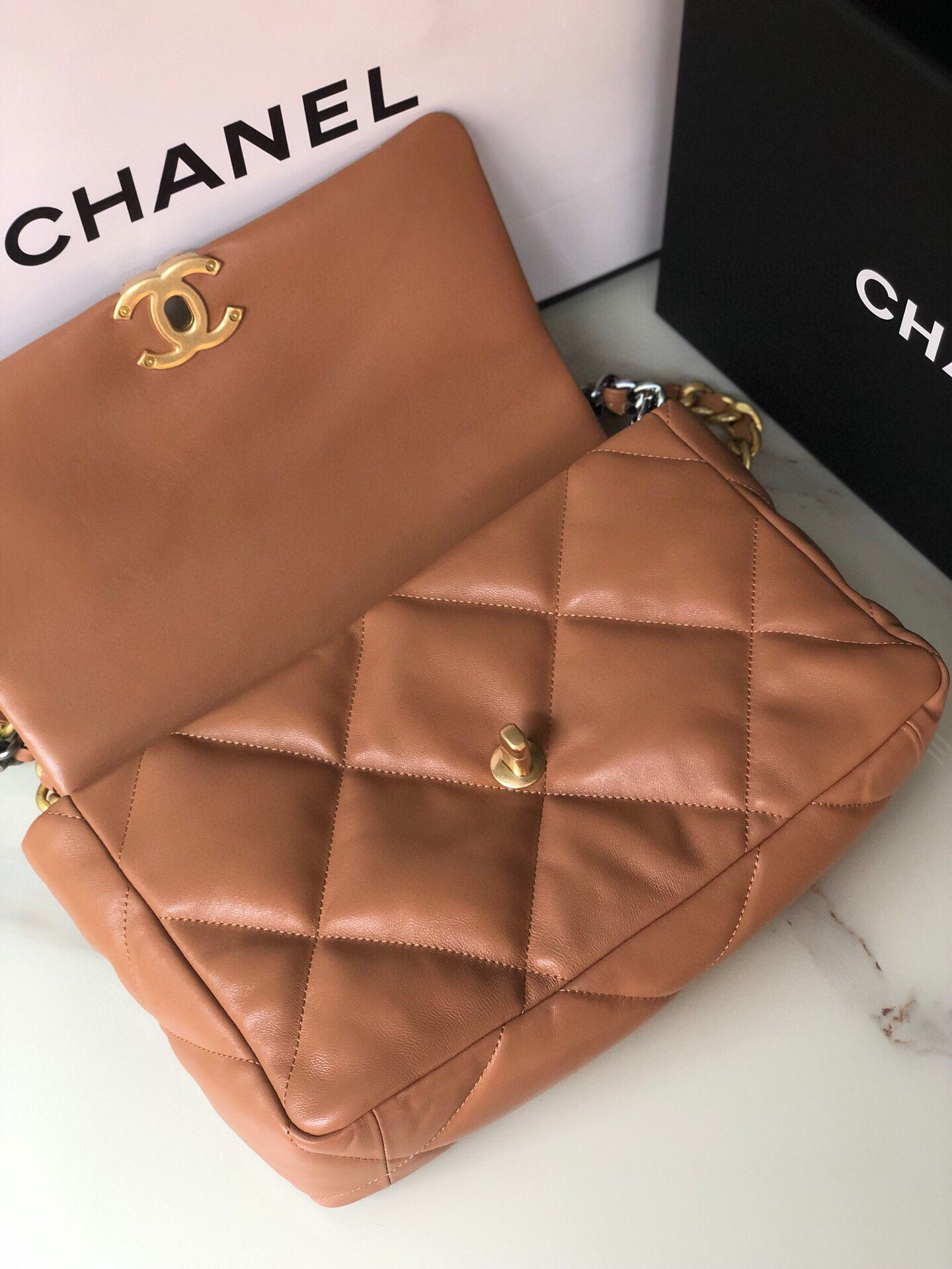 Ch*el 19 large handbag shiny leather, gold-tone, silver-tone & ruthenium-finish metal caramel 7.8 × 11.7 × 3.9 in