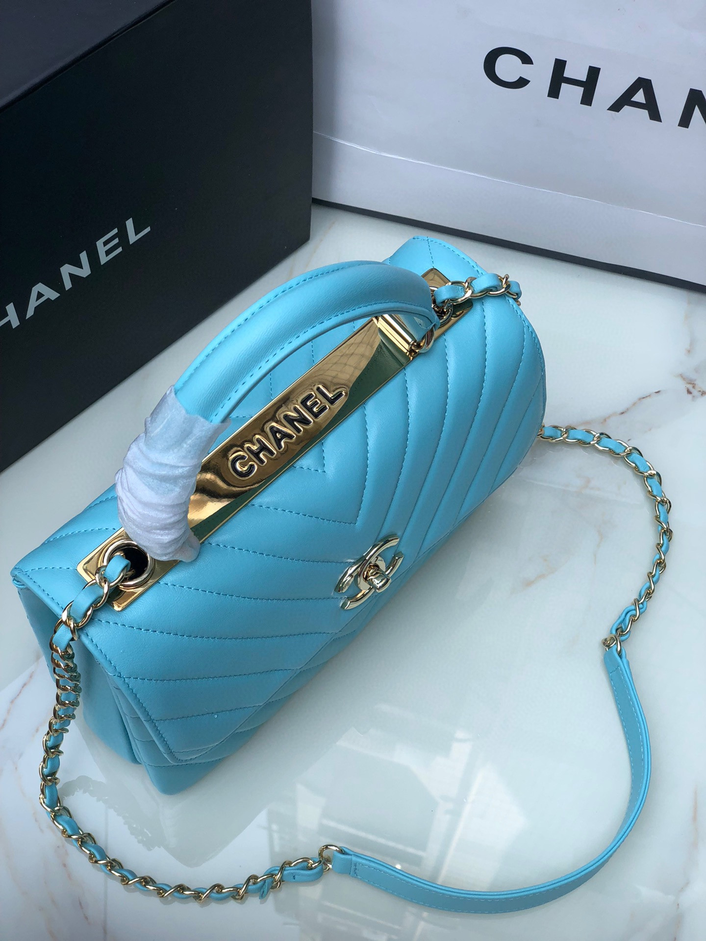 Ch*el flap bag with top handle 6.6 × 9.8 × 4.7 in