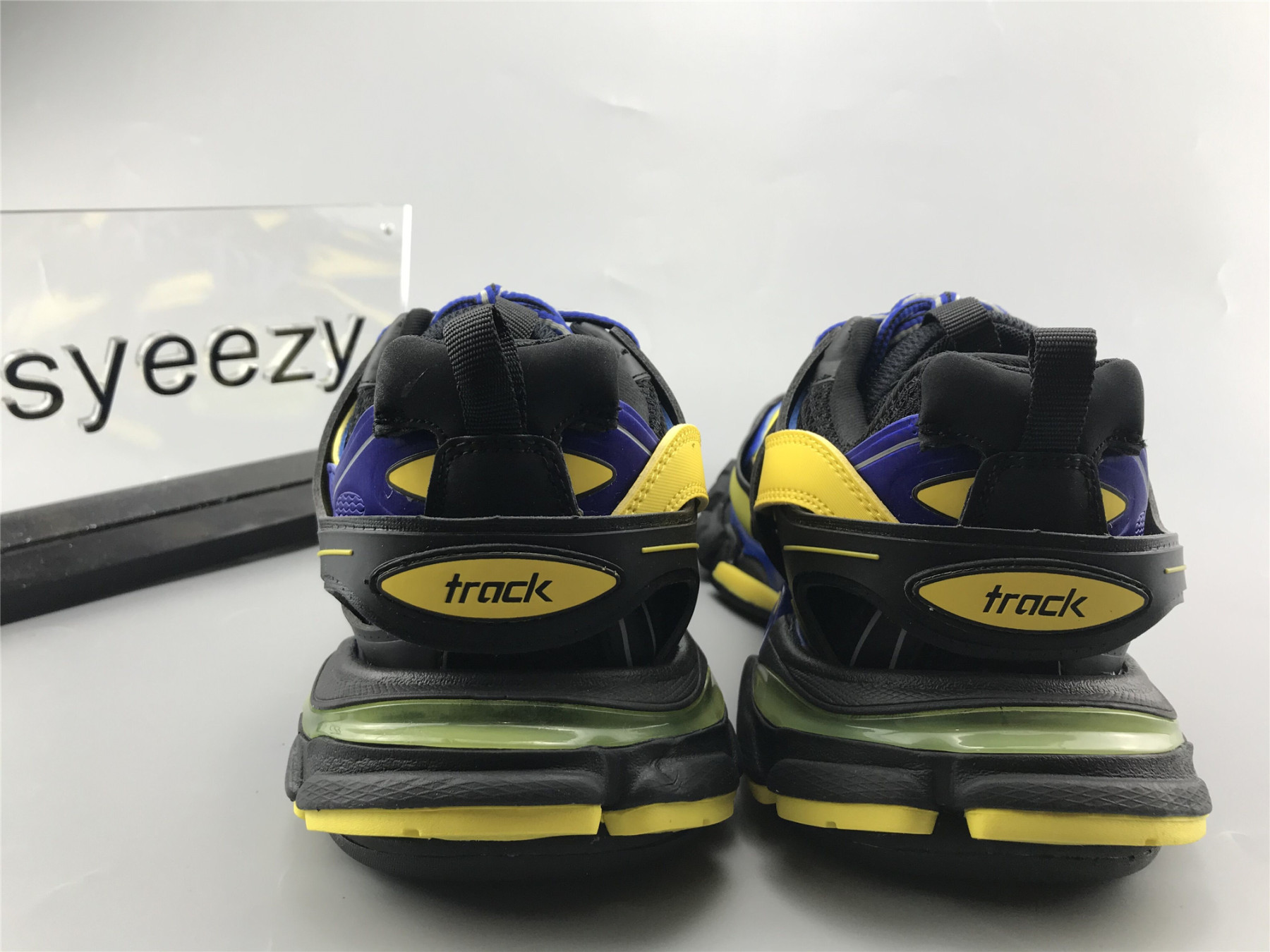 UA TRACK TRAINER BLACK YELLOW BLUE
