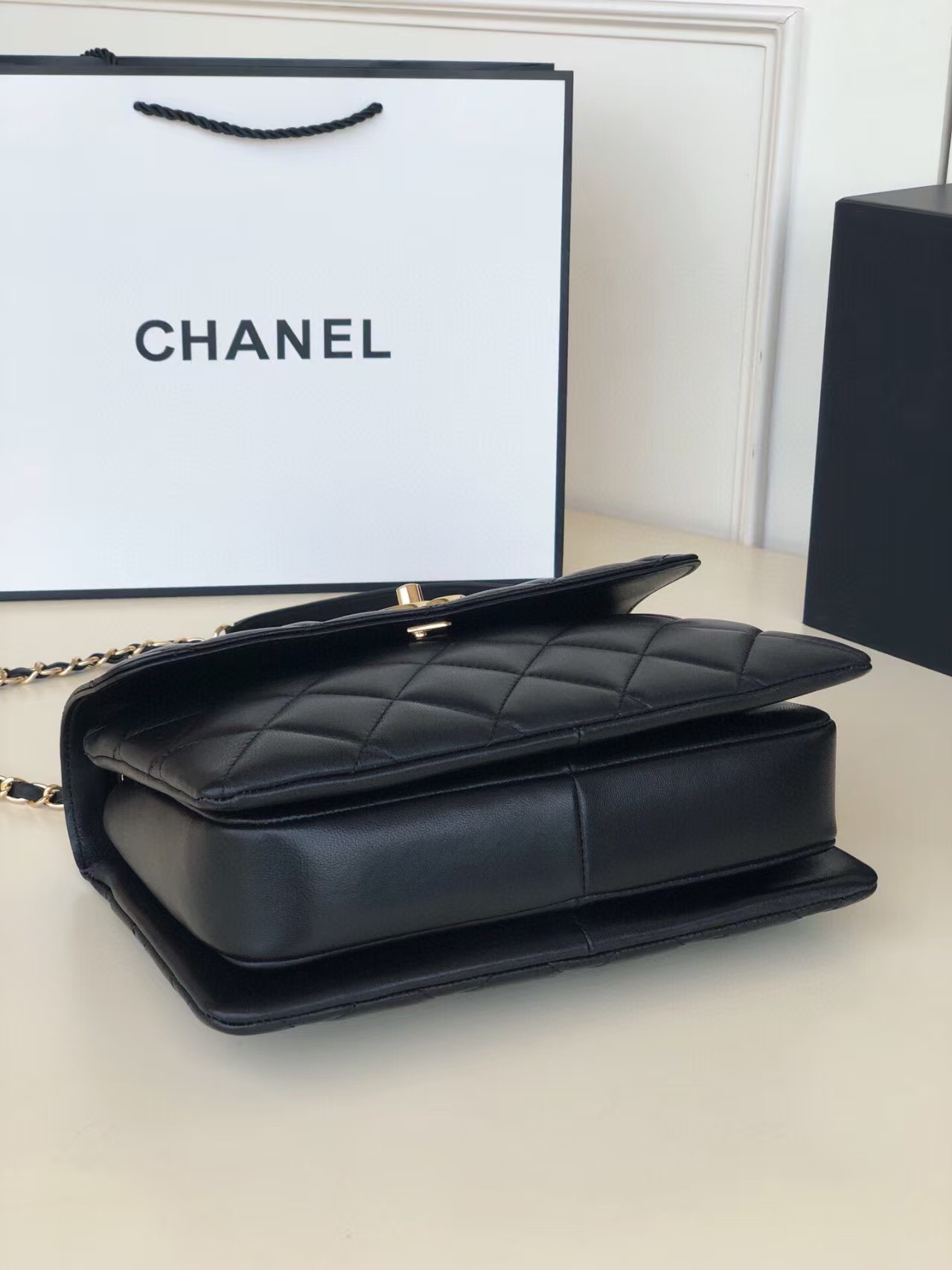 Ch**el flap bag with top handle 6.6 × 9.8 × 4.7 in