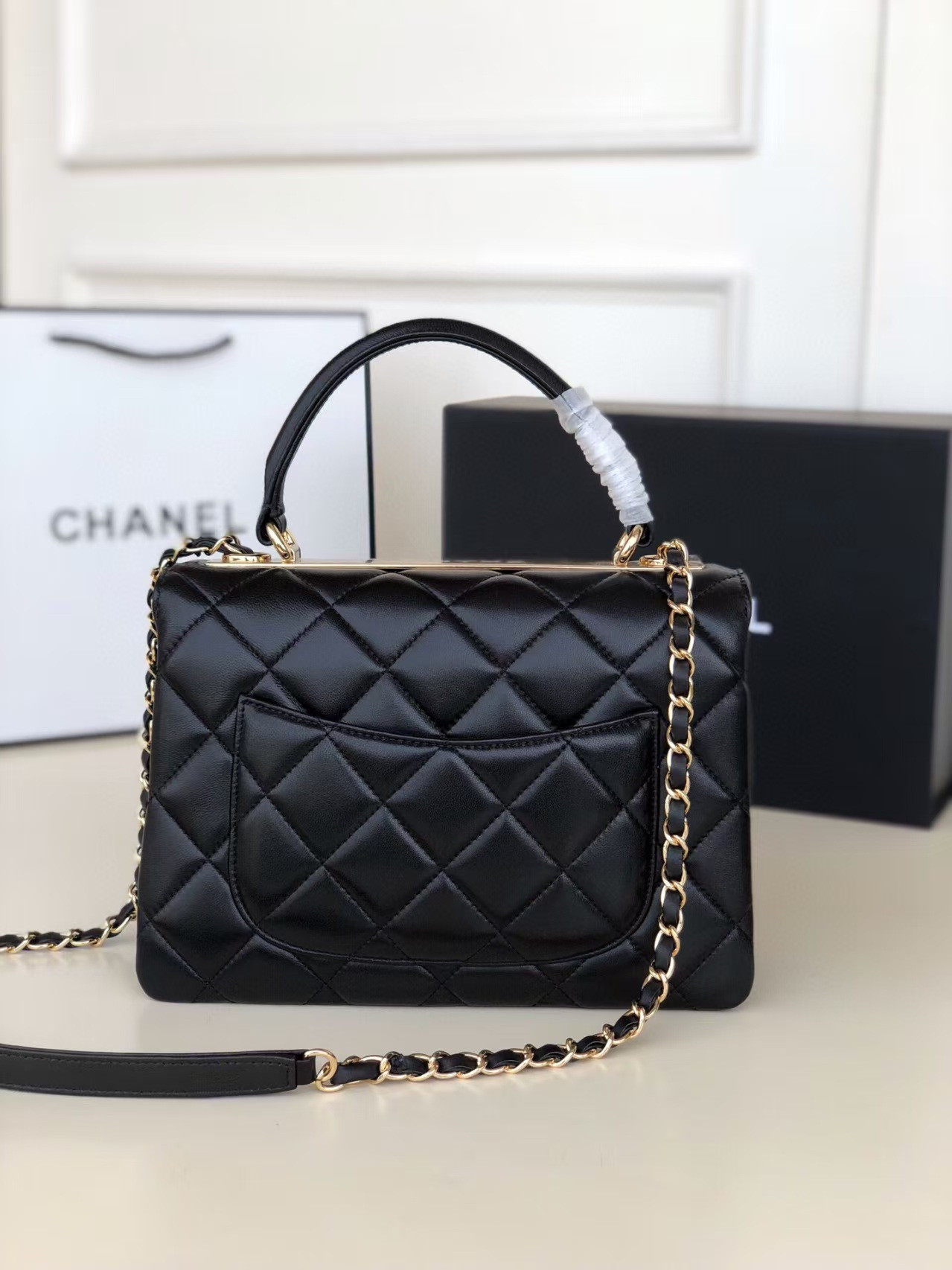 Ch**el flap bag with top handle 6.6 × 9.8 × 4.7 in