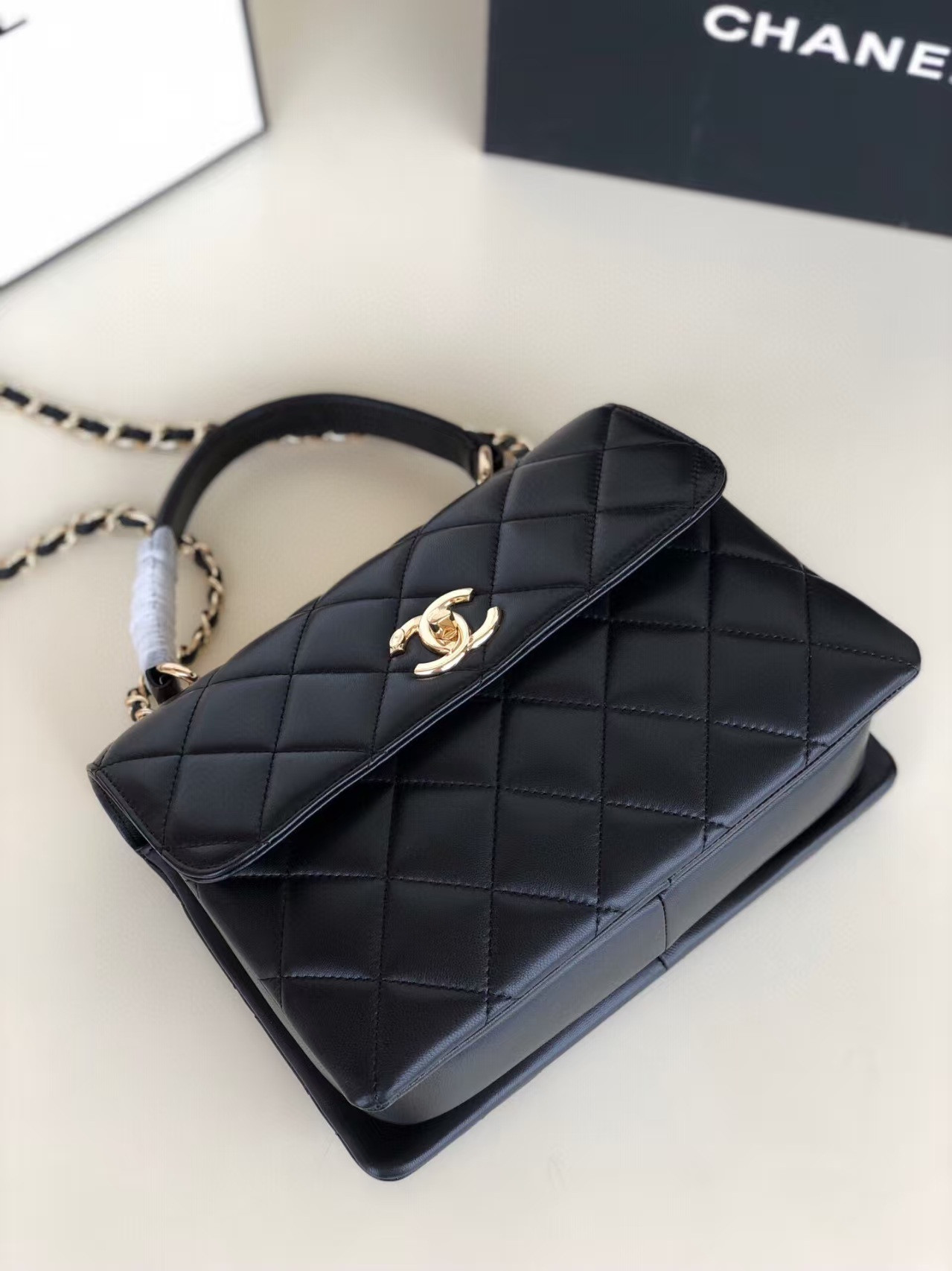 Ch**el flap bag with top handle 6.6 × 9.8 × 4.7 in