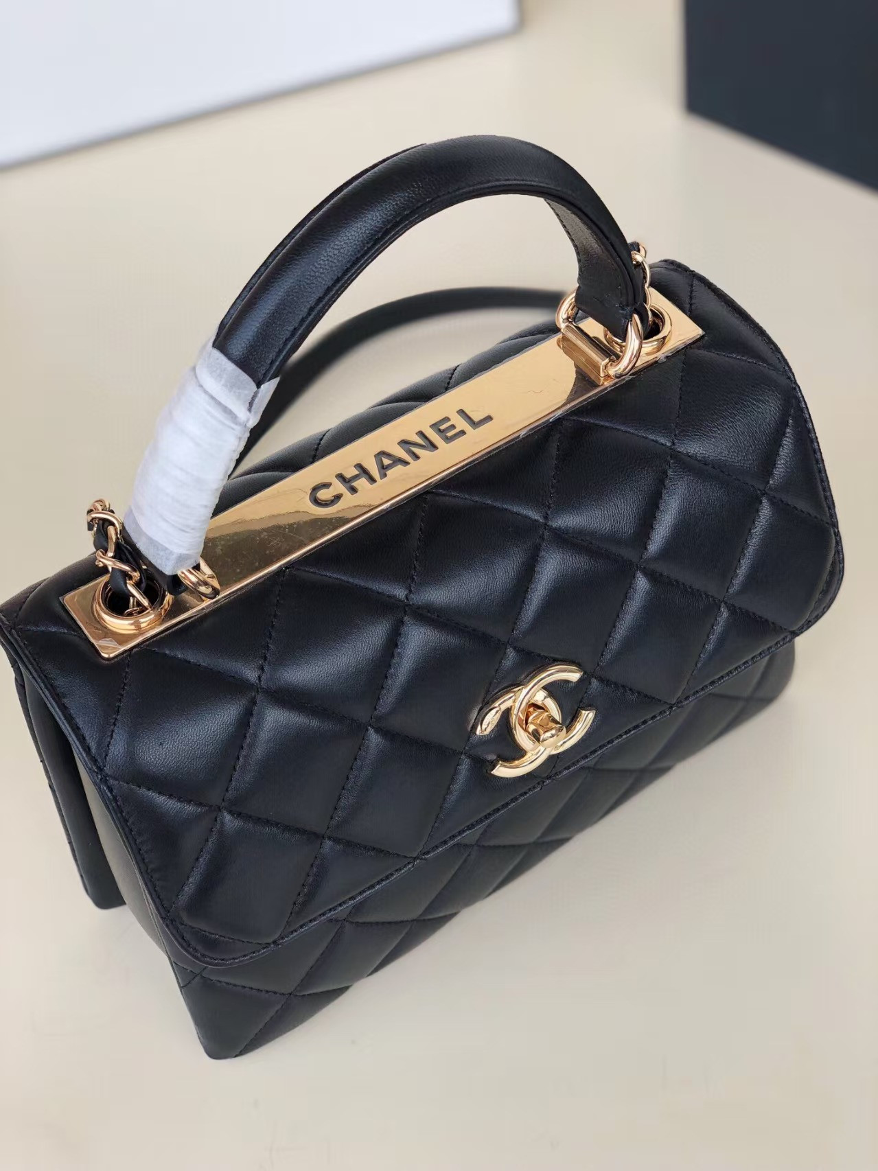 Ch**el flap bag with top handle 6.6 × 9.8 × 4.7 in